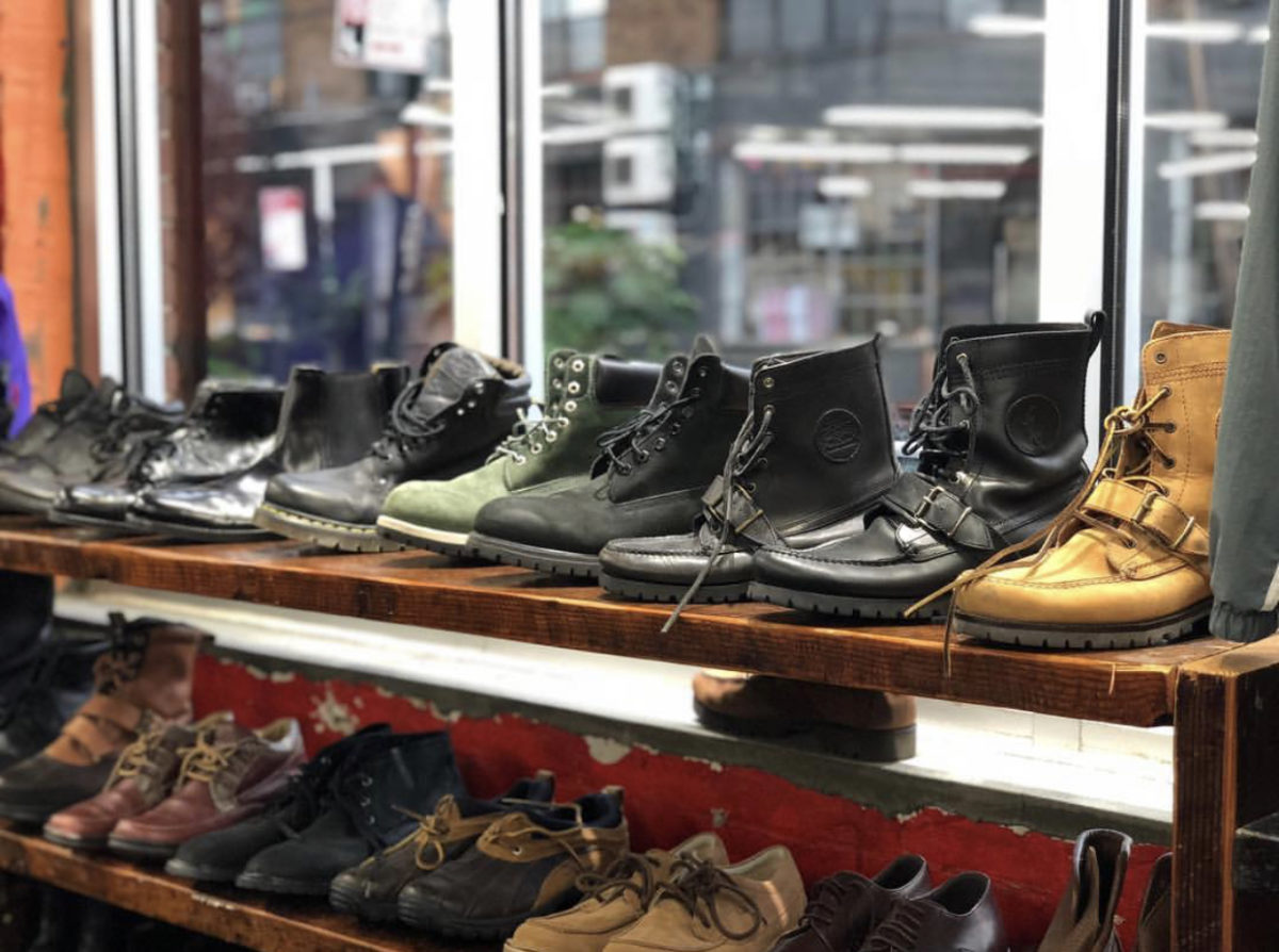 vintage shoes lined up on two rows of shelves