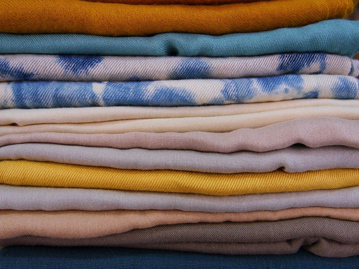 layers of colorful cotton and silk fabrics at Timro Conceptstore in Kathmandu, Nepal