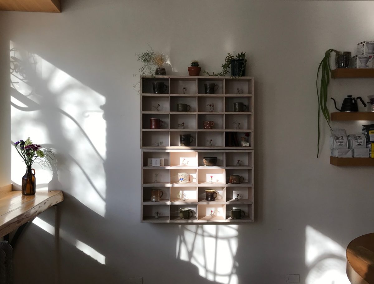 a shelf on a white wall