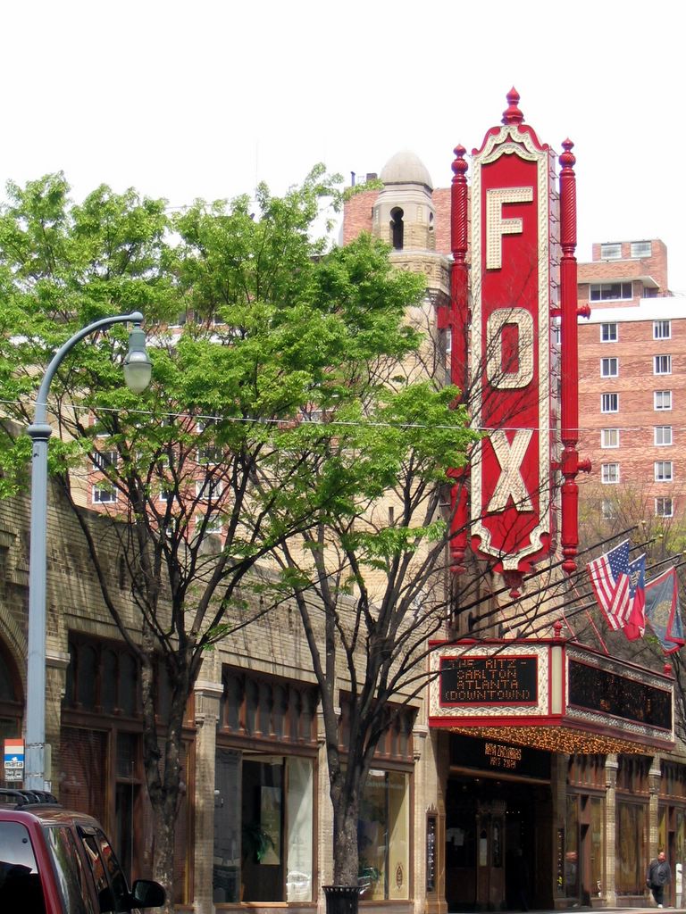 outside of a theater with an Art Deco style sign reading Fox