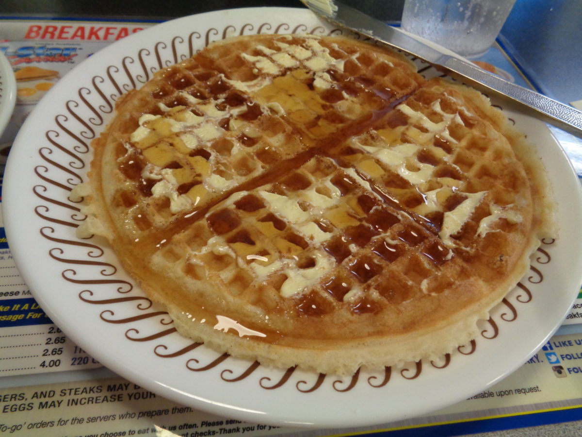 a waffle covered in butter and syrup