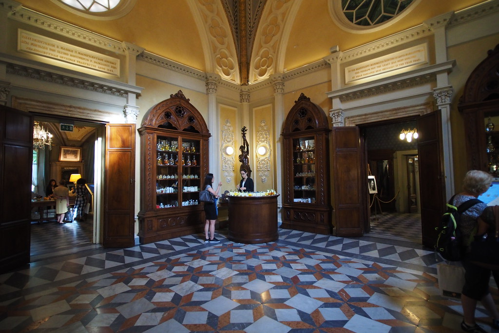 an opulent room with arched cabinets