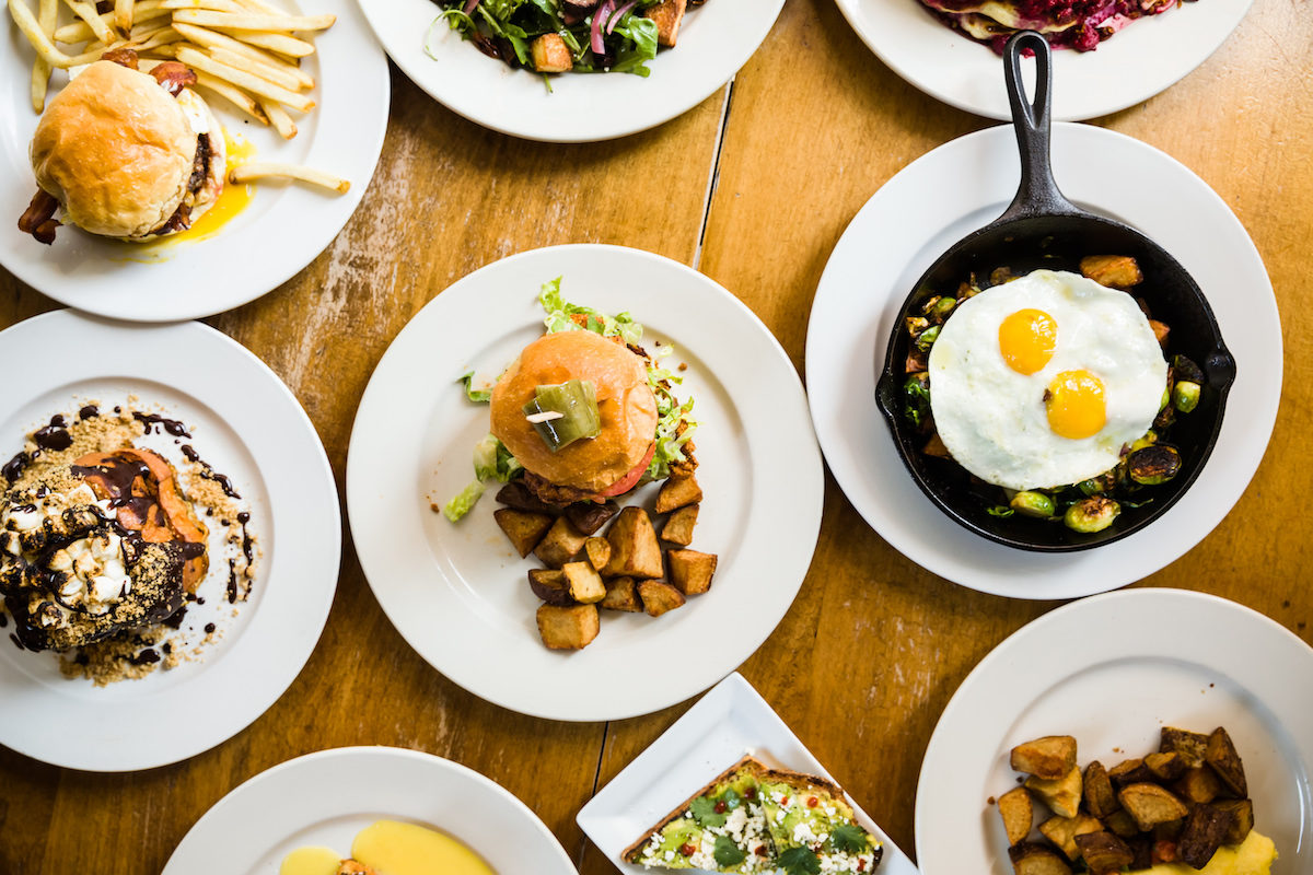 table with white plates full of food