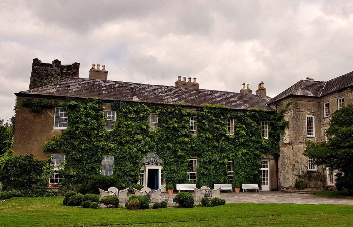 a mansion with ivy-covered walls