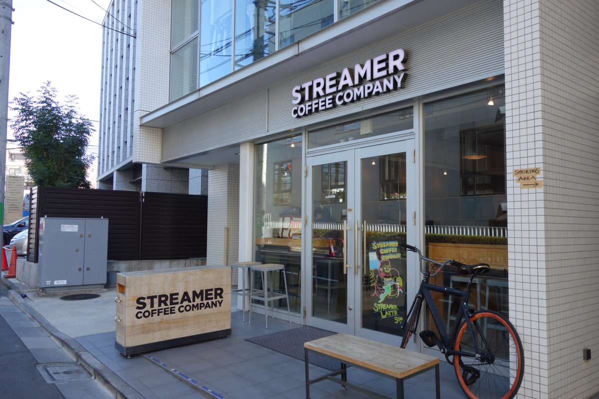 a bike sits in front of a coffee shop