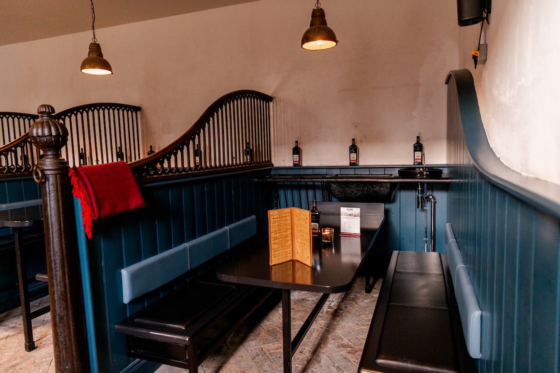 a series of booths in a dimly lit restaurant