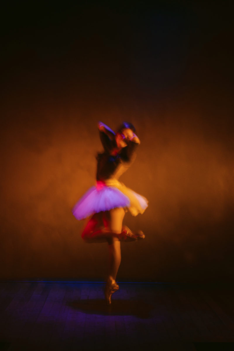 a ballerina posing on stage