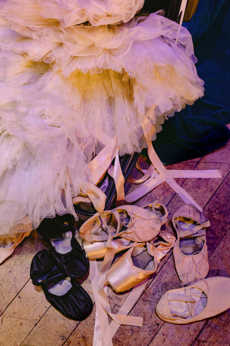 used ballet slippers and a tutu