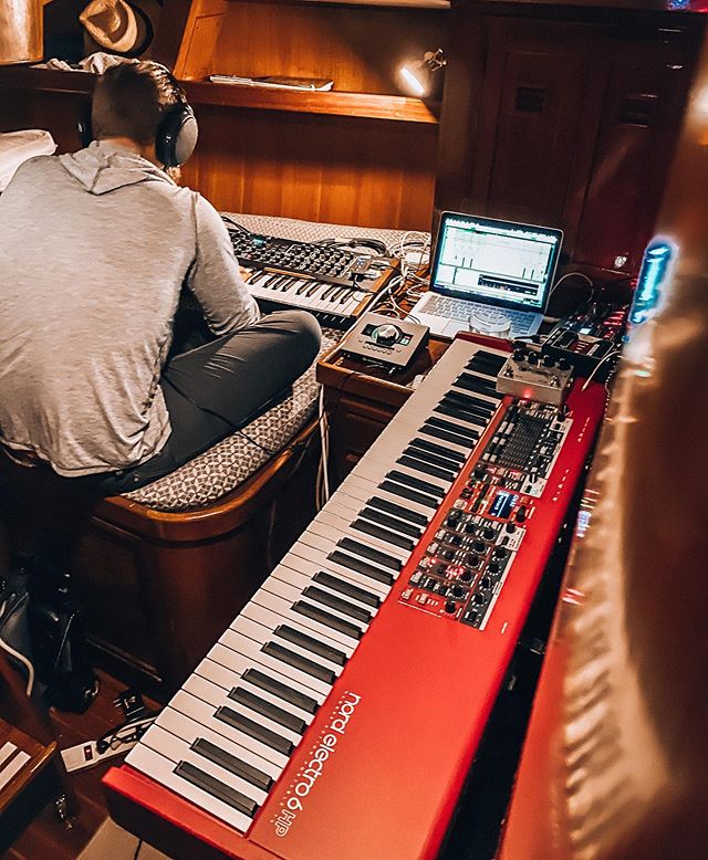 man working in music studio fit inside a sailboat