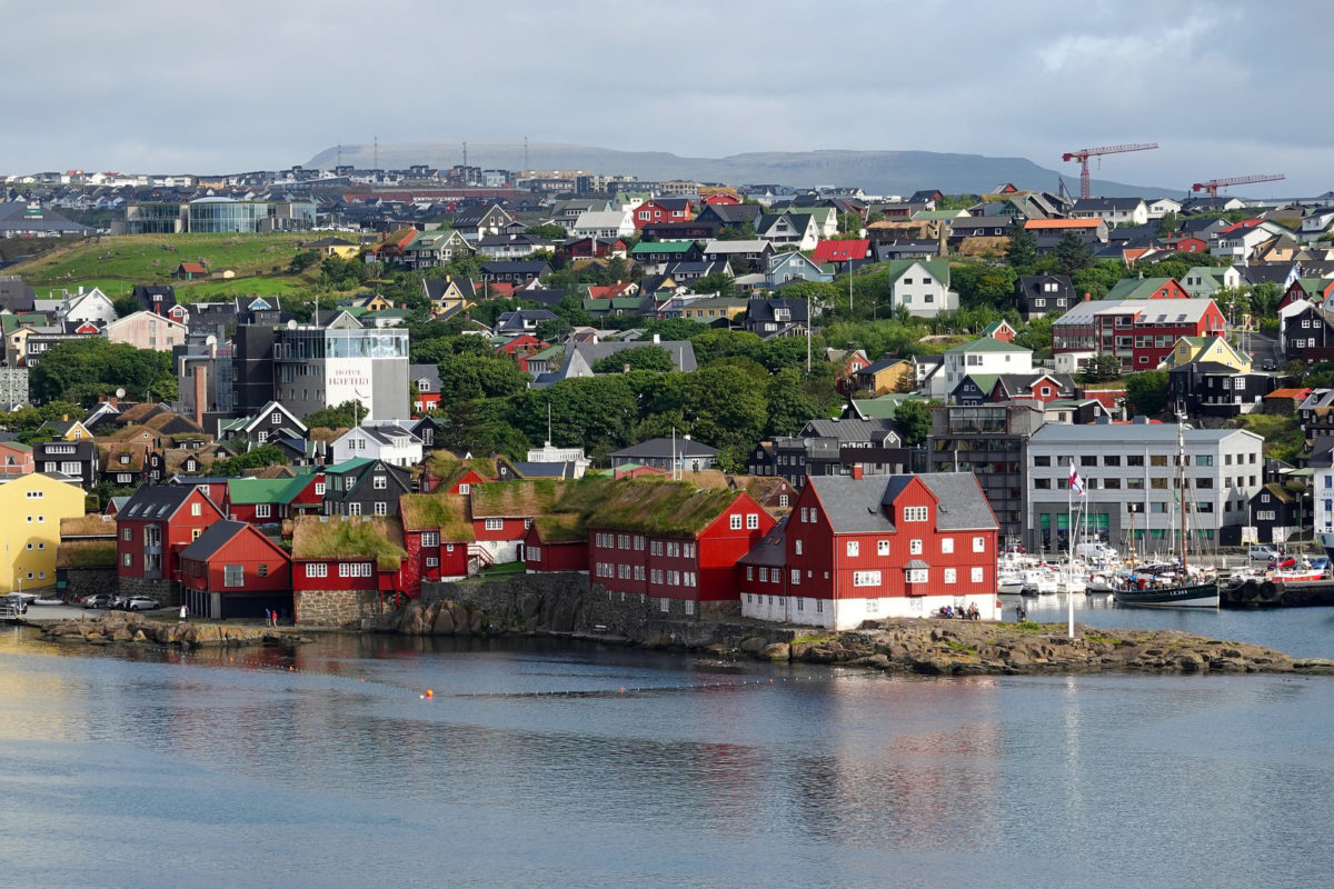 a Nordic island village as seen from the ocean