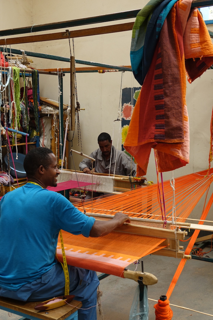 a man working at a loom