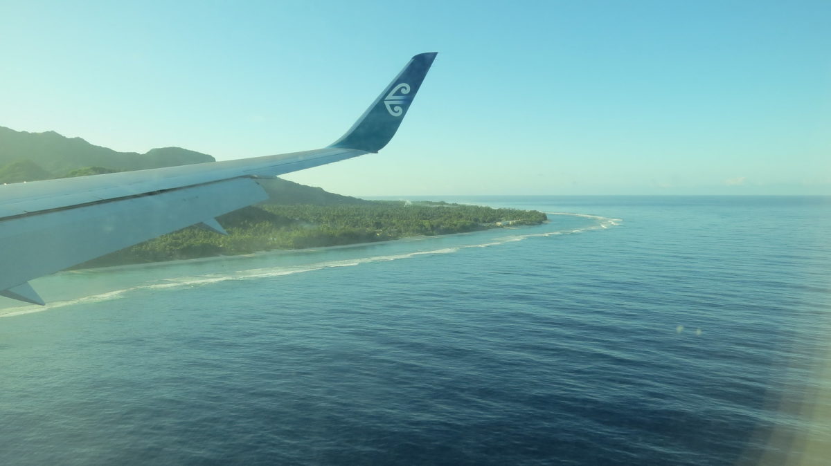 Wing of an Air Rarotonga plane flying into Rarotonga Island