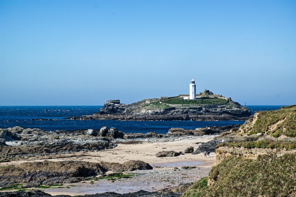 lighthouse on a small island off the coast