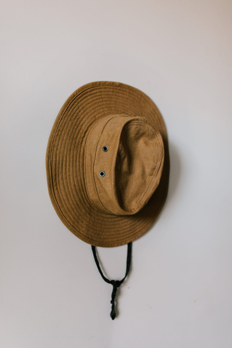 a hat hanging on a wall