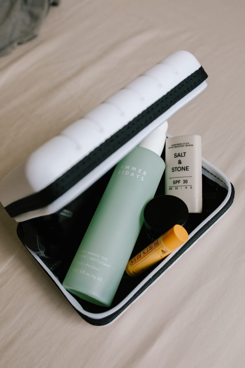 a little suitcase filled with skincare items