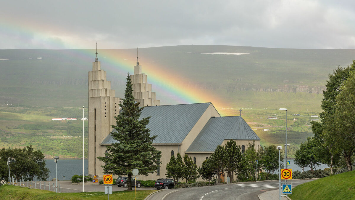 a rainbow above a church