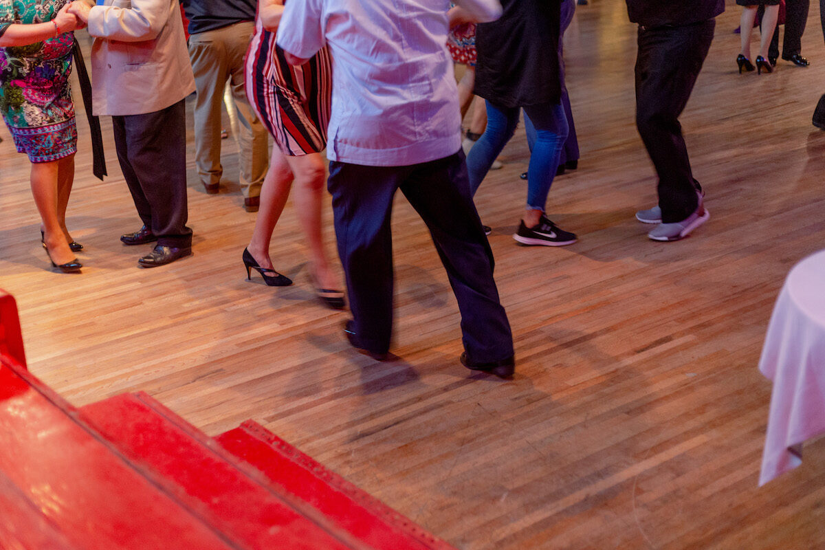 floor shot of people cumbia dancing