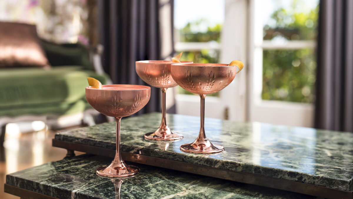 three cocktails on a marble counter