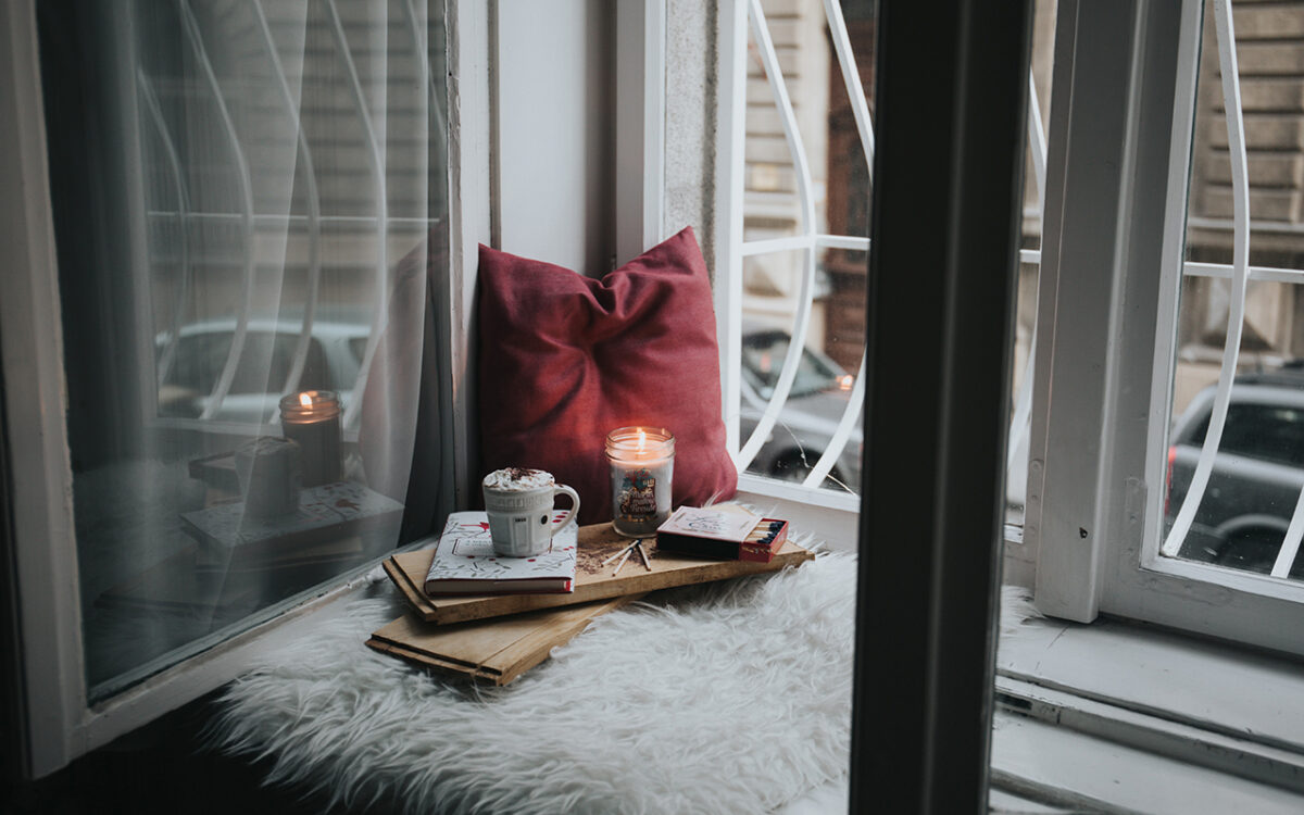 books and candles in a reading nook